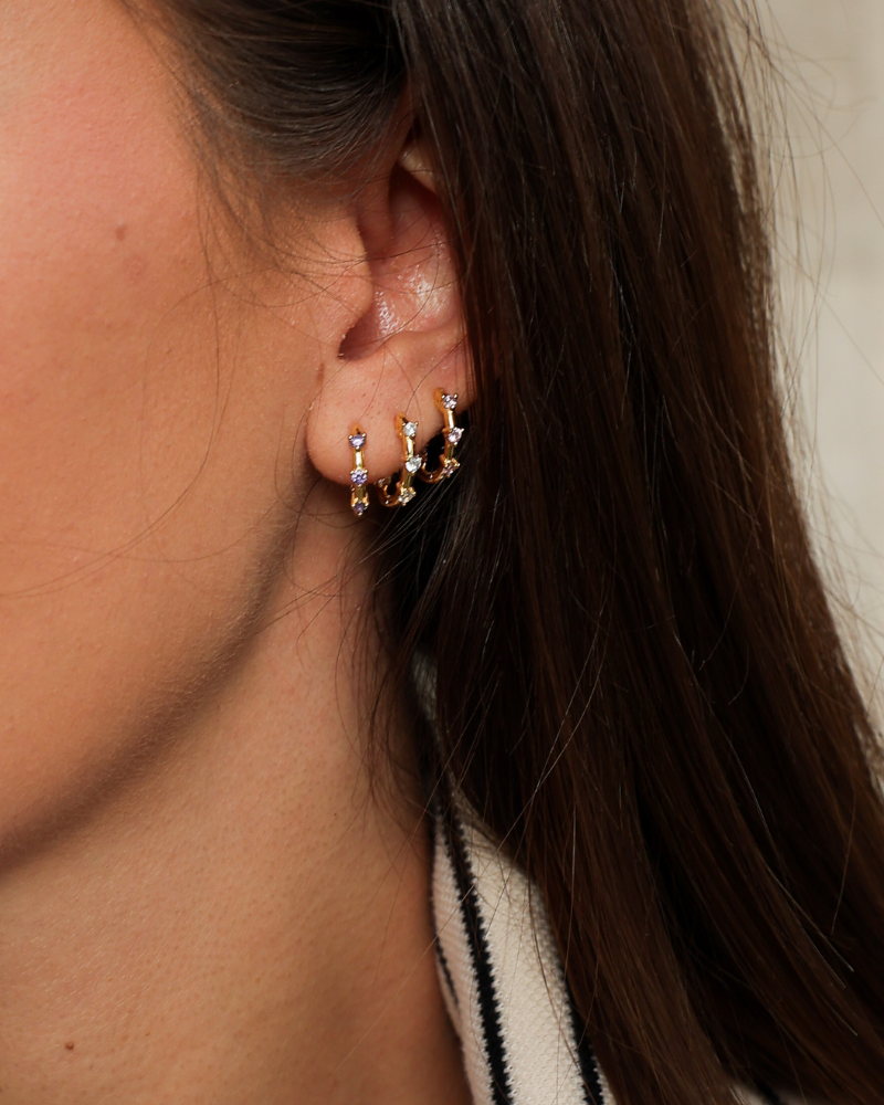 Pendientes mini aritos tres circonitas rosa palo
