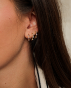 Mini hoop earrings with three lavender zircons