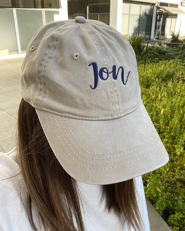 Beige cap with Jon embroidery in navy blue