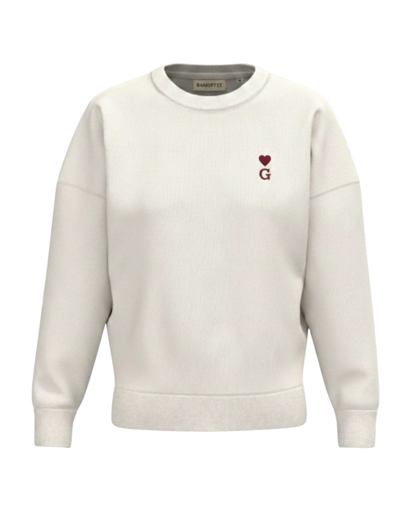 Sudadera beige de mujer personalizada con inicial y mini corazón bordado en el pecho izquierdo